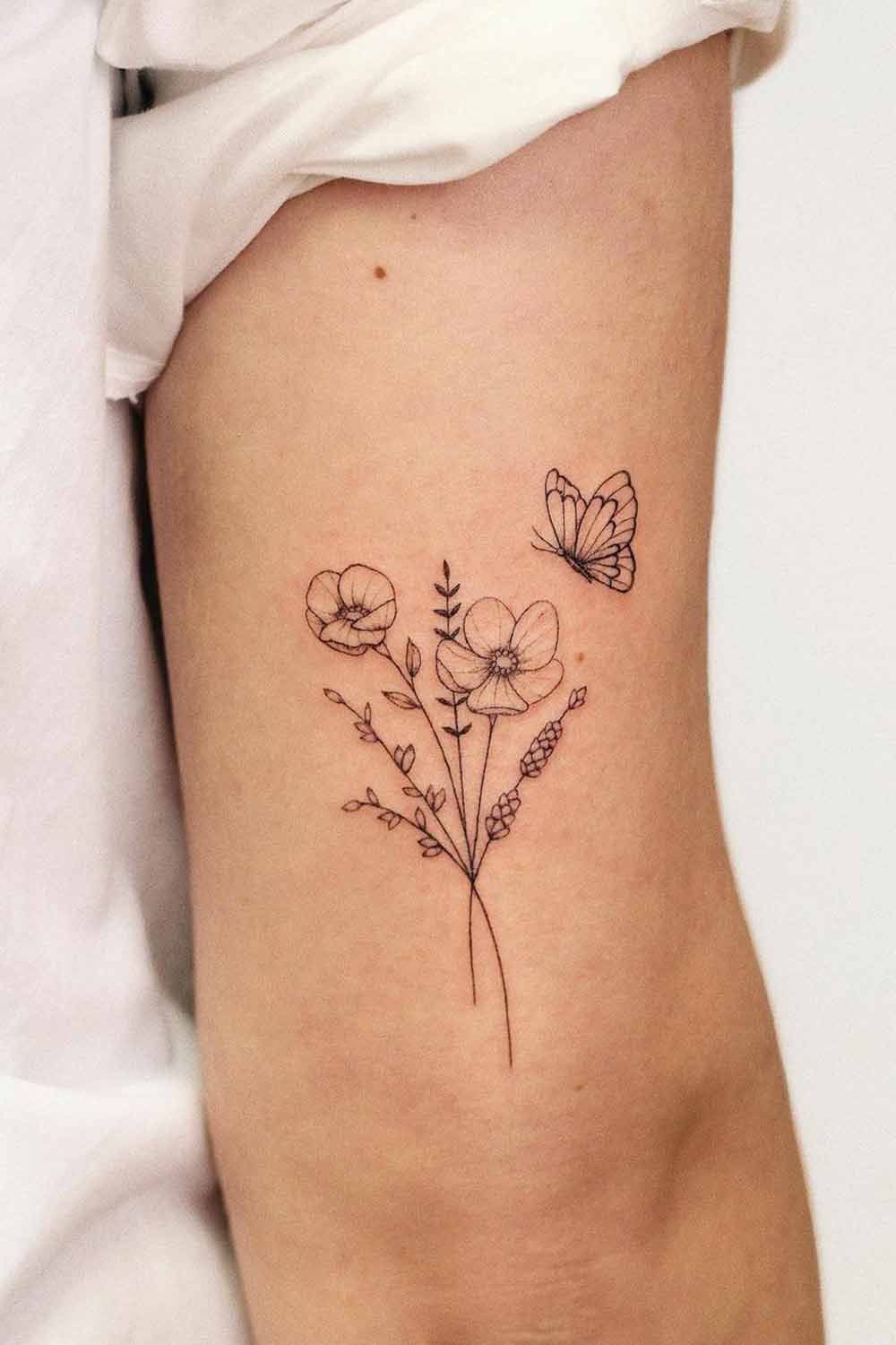 tatuagem-de-ramo-de-flor-com-borboleta-no-braco 