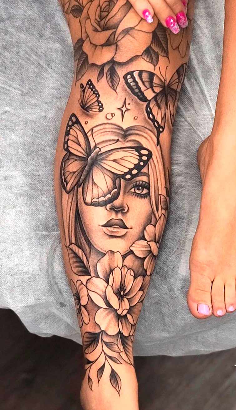 tatuagem-feminina-na-perna-de-borboleta-e-rosas 