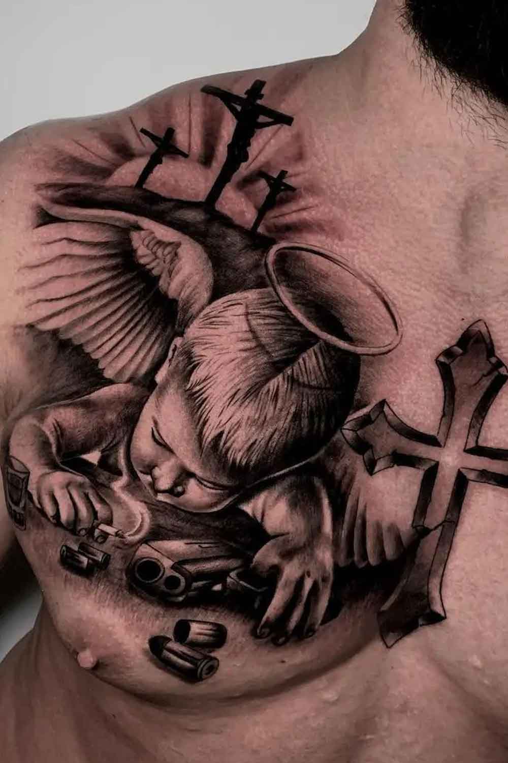 tatuagem-de-anjo-e-cruz-no-peito 