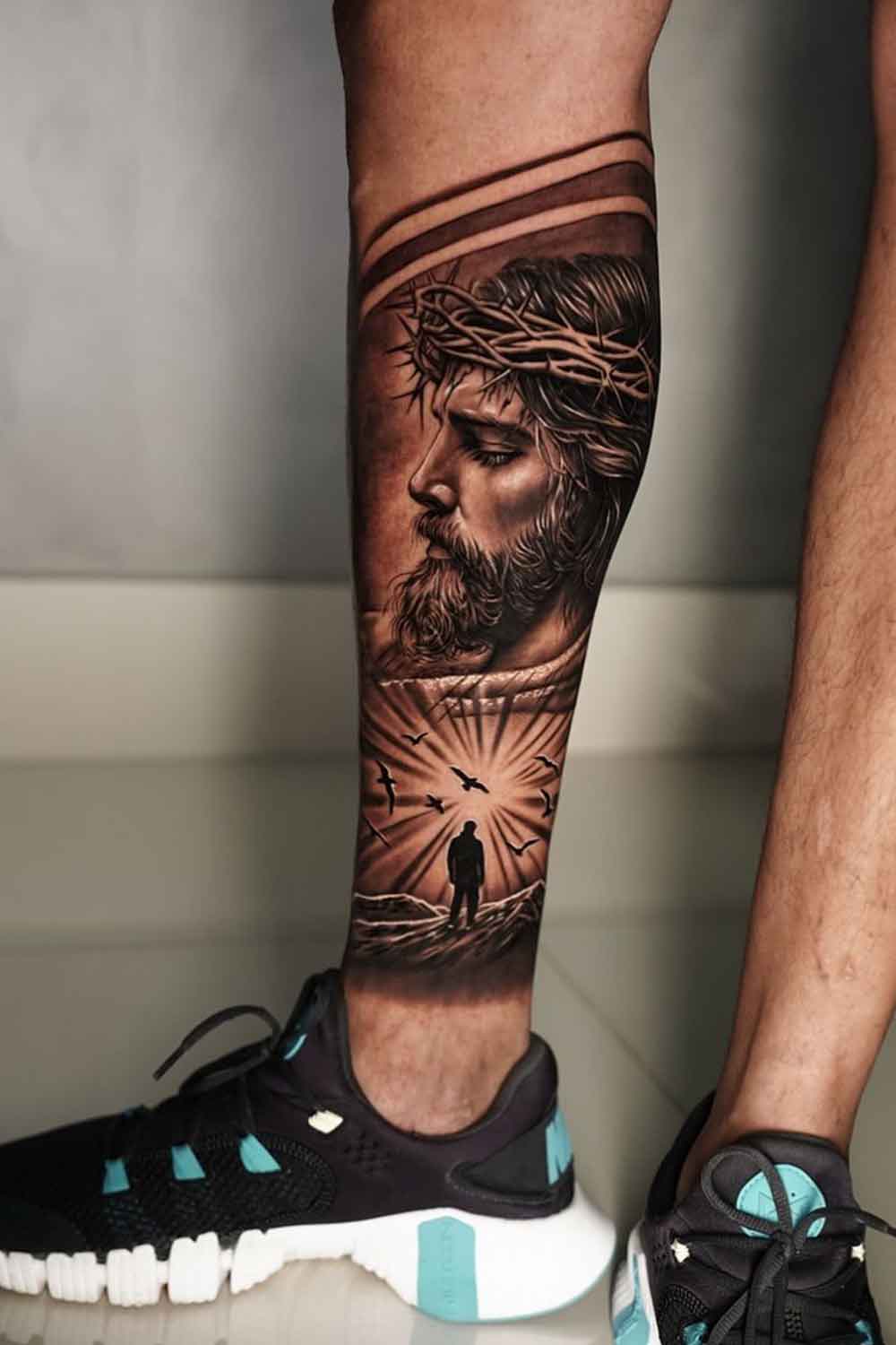 tatuagem-do-rosto-de-jesus-na-perna 